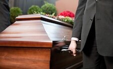 coffin-bearer-carrying-casket-funeral.jpeg