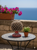 mezza-pigna-in-ceramica-smaltata-beige-con-base-decorata