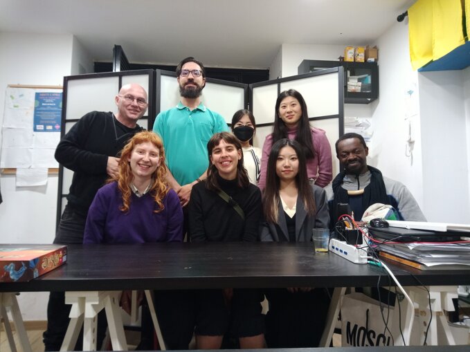 Group of diverse individuals inside an office setting Group of diverse individuals inside an office setting