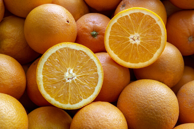 Fresh organic oranges showcasing Sicilian heritage and Catania agriculture.