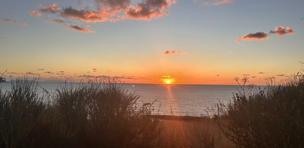A beautiful landscape with a low sun on the horizon.