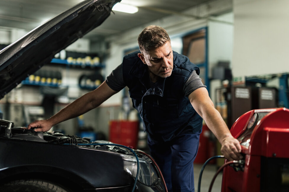 mid-adult-mechanic-doing-service-car-s-air-conditioner-unit-auto-repair-shop.jpeg