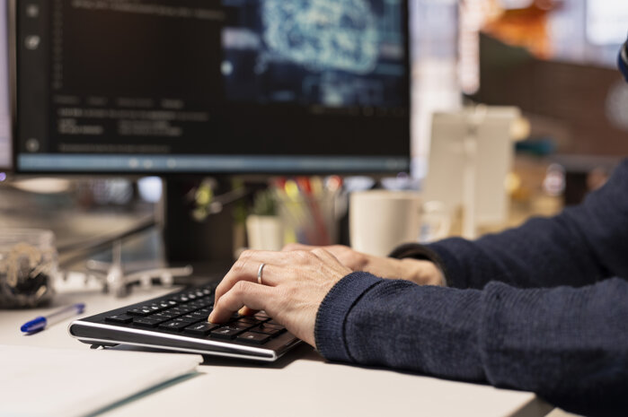 startup-programmer-leveraging-artificial-intelligence-tech-office-close-up.jpeg