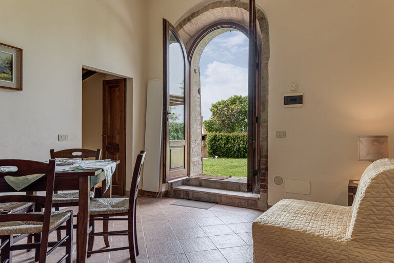 Comfortable double bedroom with private bathroom and kitchen for large group accommodation in Tuscany