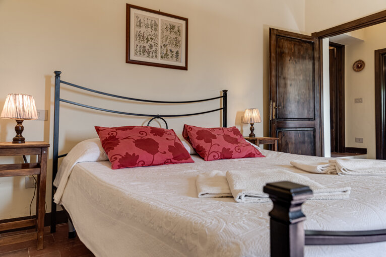 Comfortable double bedroom and double sofa bed with private bathroom and kitchen for large group accommodation in Tuscany villa