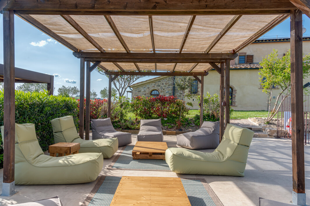 Sun loungers and relaxation chairs next to the exclusive use swimming pool in Tuscany