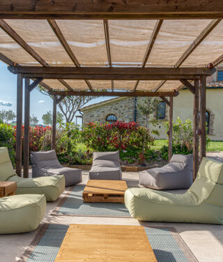 Sun loungers and relaxation chairs next to the exclusive use swimming pool in Tuscany