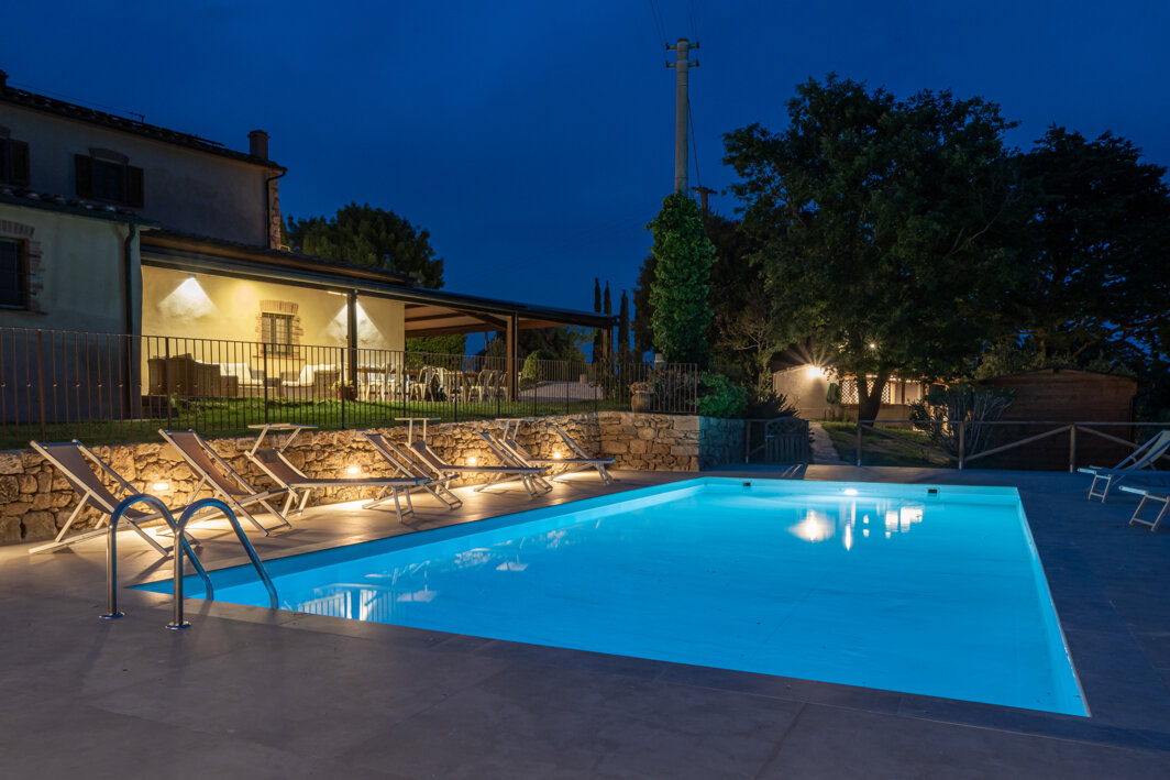 Private swimming pool at night for luxury evening gatherings at the Tuscan villa