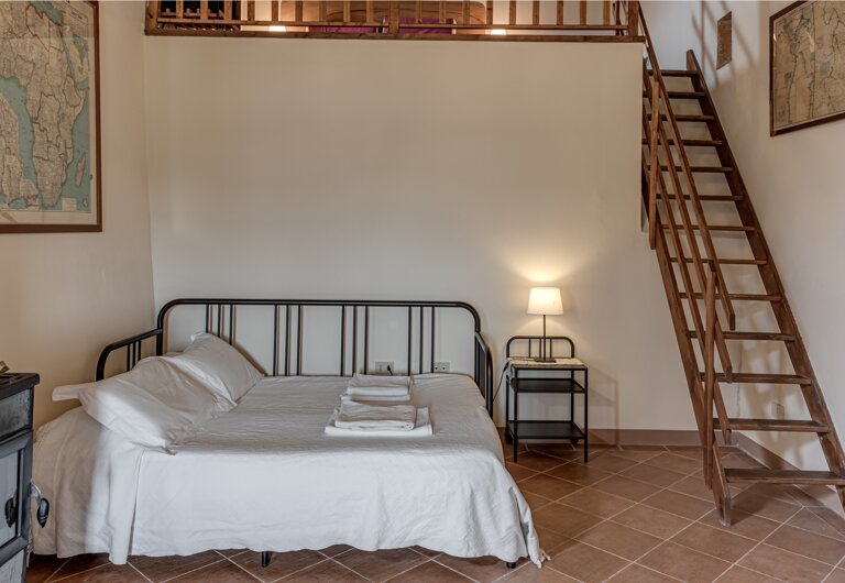 Comfortable double bedroom and twin sofa bed with private bathroom and kitchen for large group accommodation in Tuscany