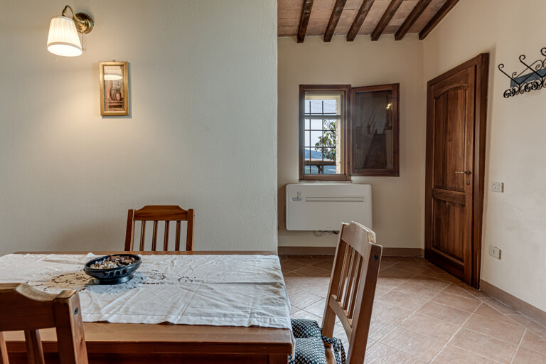 Comfortable double bedroom and twin sofa bed with private bathroom and kitchen for large group accommodation in Tuscany