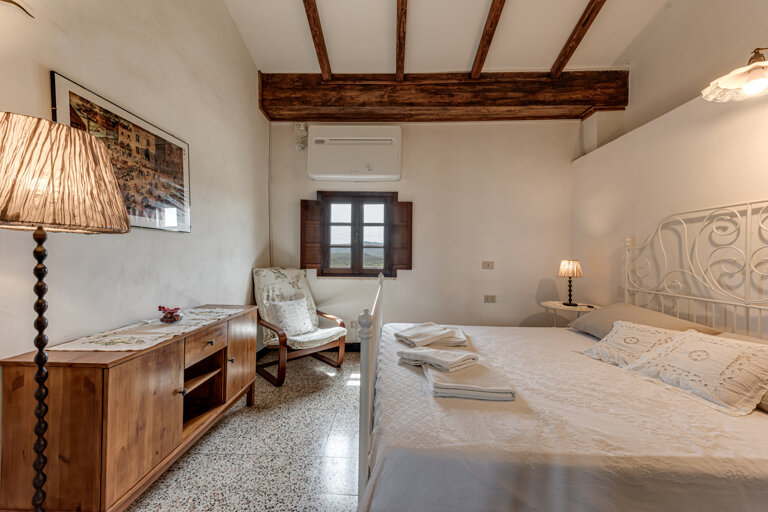 Spacious family accommodation with four beds and private bathroom suitable for large families in the Tuscan villa