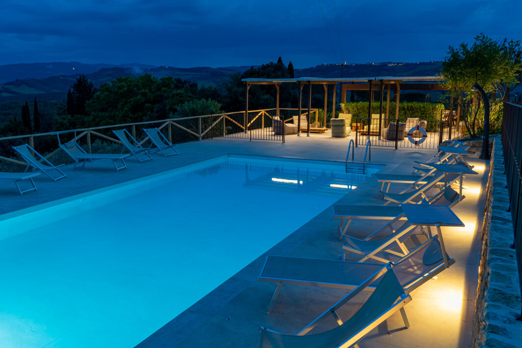 Private swimming pool at night for luxury evening gatherings at the Tuscan villa