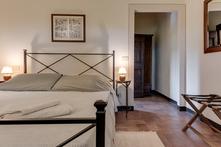 Comfortable double bedroom with private en-suite bathroom at Tuscany villa