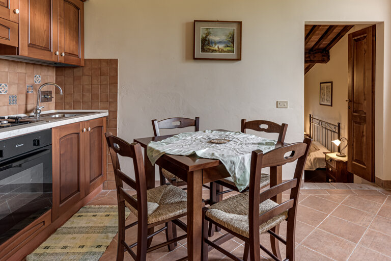Comfortable double bedroom with private bathroom and kitchen for large group accommodation in Tuscany