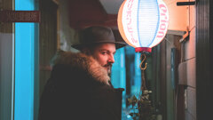 MURDAH SRVC musician in a Japanese alley with Orion beer lantern - cinematic storytelling photography