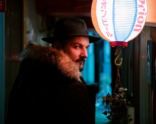 MURDAH SRVC musician portrait with neon lighting - mysterious artist persona inspired by manga culture