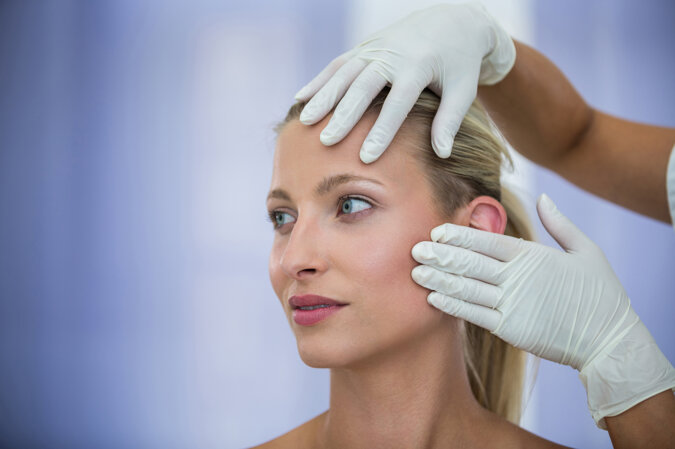 doctor-examining-female-patients-face-from-cosmetic-treatment.jpeg doctor-examining-female-patients-face-from-cosmetic-treatment.jpeg