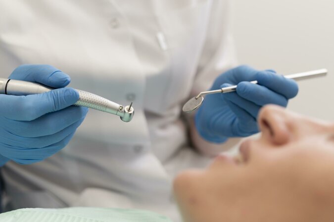 female-patient-having-procedure-done-dentist.jpeg