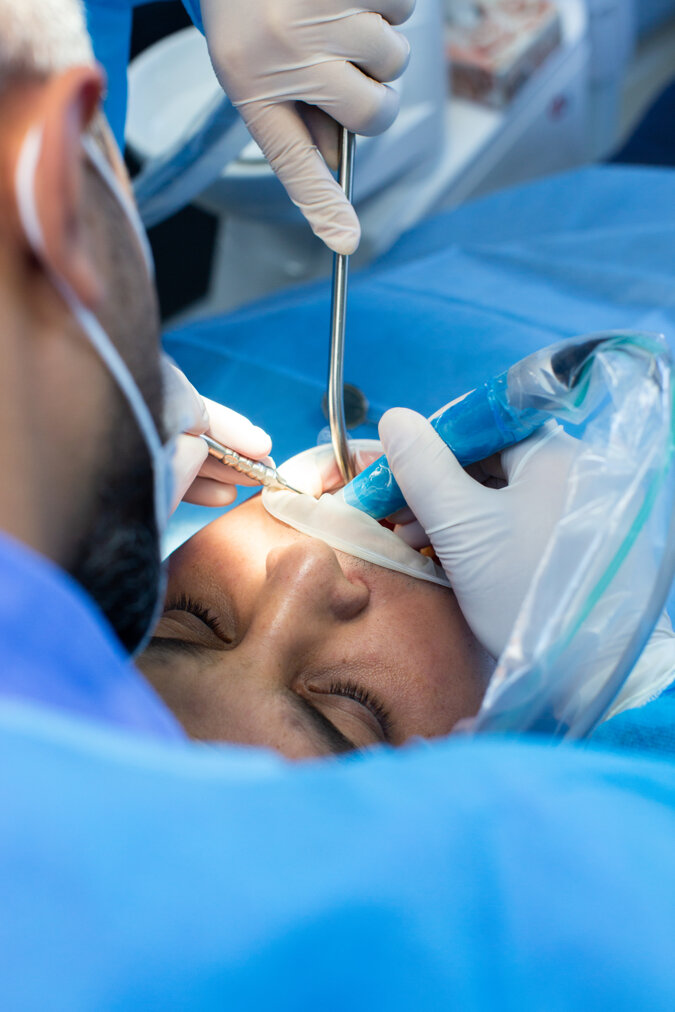 dentist-assistant-with-tool-makes-some-manipulations-patient-s-mouth.jpeg dentist-assistant-with-tool-makes-some-manipulations-patient-s-mouth.jpeg