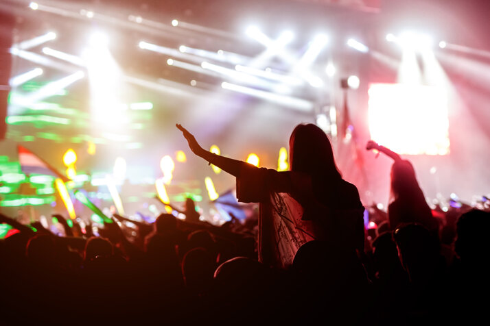 woman-enjoying-music-festival-concert.jpeg