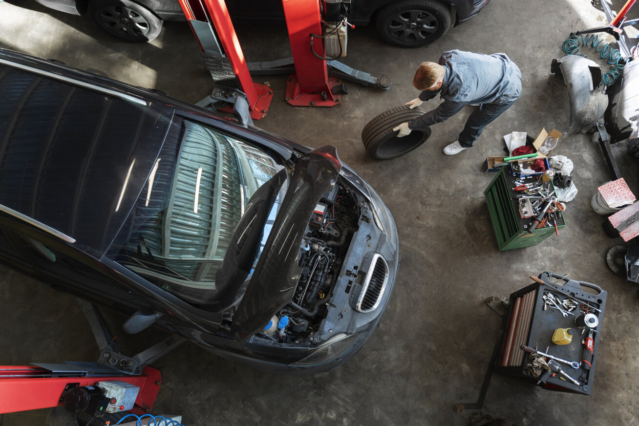 top-view-man-repairing-car.jpeg