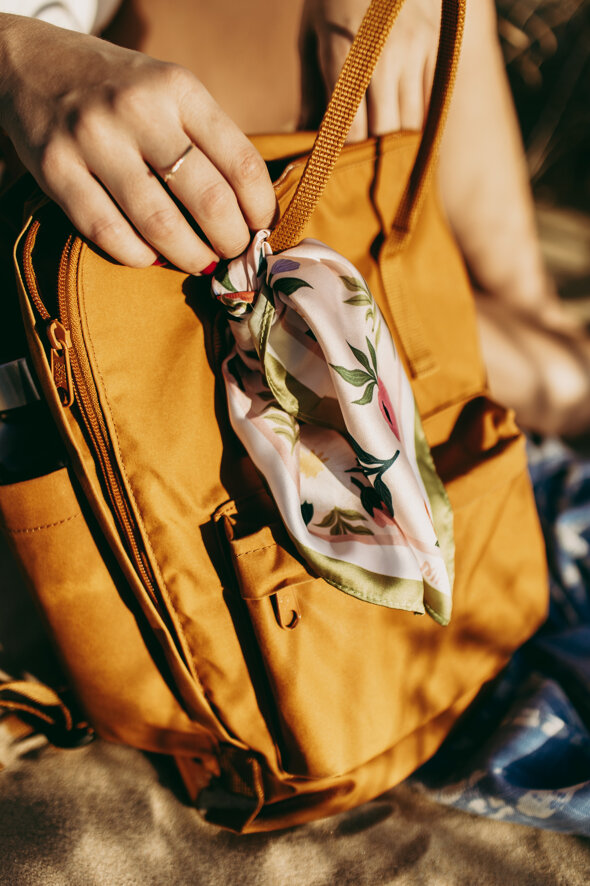 vertical-shot-female-holding-fashionable-leather-bg.jpeg