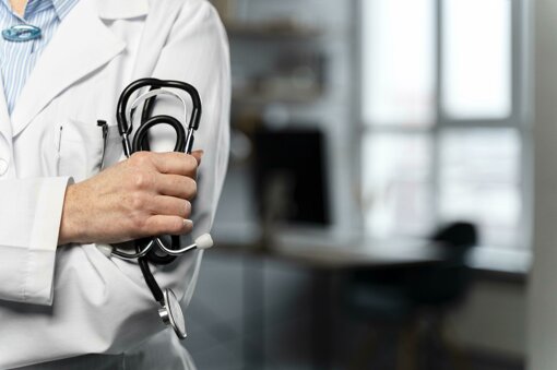 front-view-female-doctor-holding-stethoscope-with-copy-space.jpeg
