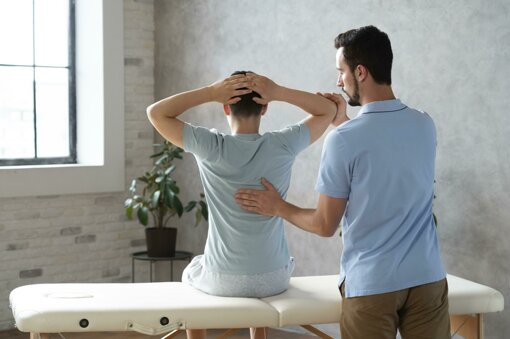medium-shot-man-helping-patient-physiotherapy.jpeg