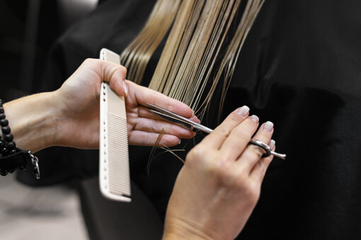 woman-getting-her-hair-cut-beauty-salon.jpeg