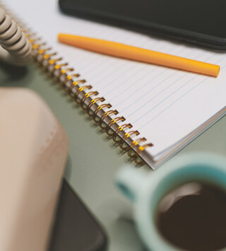 Notebook and pencil for content and project planning