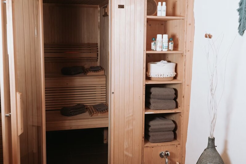 Private sauna with premium wellness products and fresh towels at Harmony Wellness in Vitznau on Lake Lucerne.