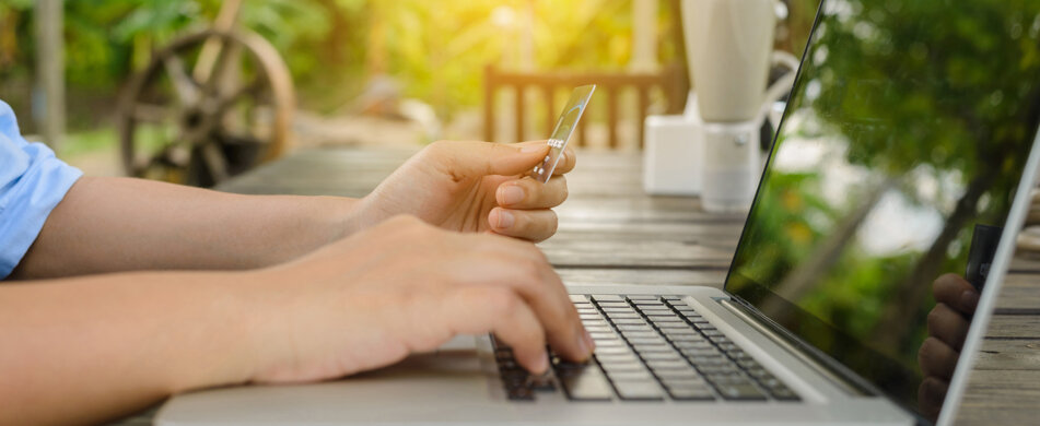 woman-holding-credit-card-hand-entering-security-code-using-laptop.jpeg